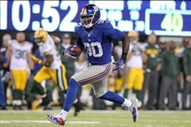 Dallas Cowboys Tony Romo runs out of the pocket in the first quarter  against the New York Giants in week 13 of the NFL season at Giants Stadium  in East Rutherford, New