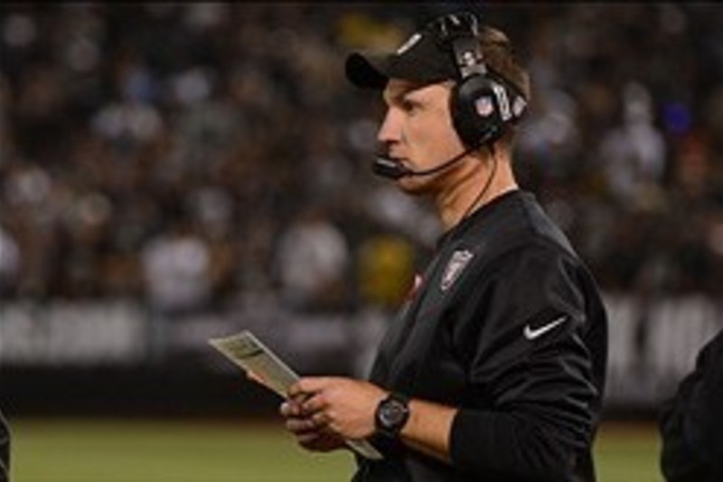 Oakland Raiders' head coach Dennis Allen looks at the replay screen in  their game against the Seattle Seahawks at CenturyLink Field in Seattle,  Washington on August 30, 2012. The Seahawks beat the