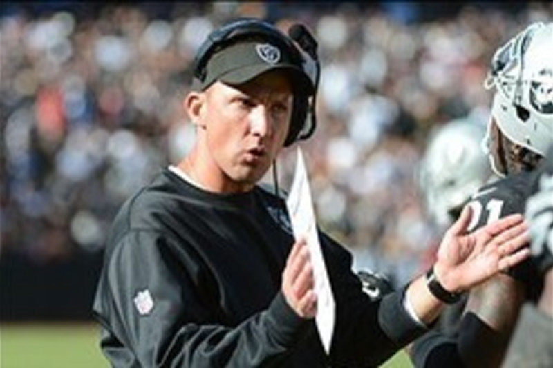 Oakland Raiders' head coach Dennis Allen looks at the replay screen in  their game against the Seattle Seahawks at CenturyLink Field in Seattle,  Washington on August 30, 2012. The Seahawks beat the