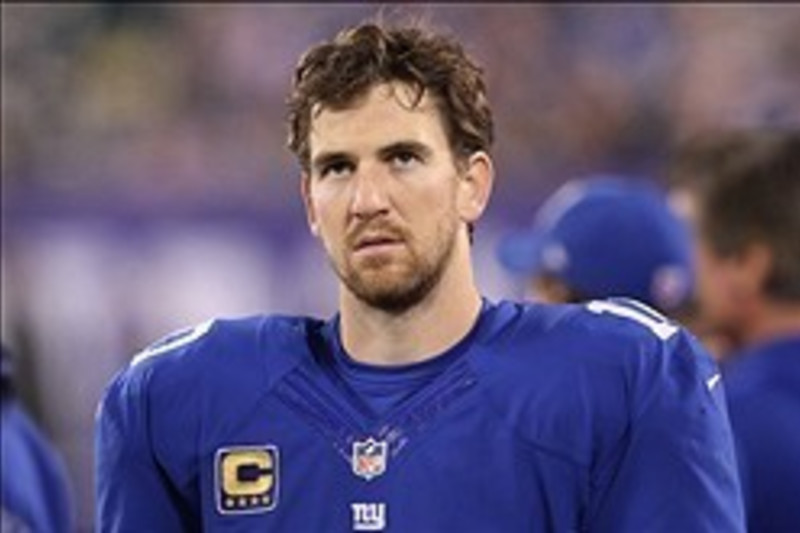 New York Giants starting quarterback Eli Manning rolls out to the right  against the Washington Redskins in the first quarter at Giants Stadium in  East Rutherford, New Jersey on December 16, 2007. (