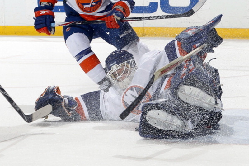 Rick DiPietro #39 of the New York Islanders, while wearing…