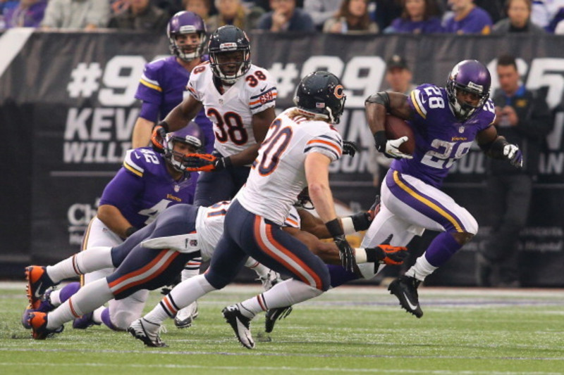 Minnesota Vikings running back Adrian Peterson runs for a gain during the  fourth quarter against the Chicago Bears at Soldier Field in Chicago on  December 28, 2009. The Bears won 36-30 in