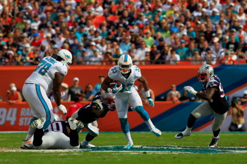 Miami Dolphins runningback Daniel Thomas (33) runs for yardage