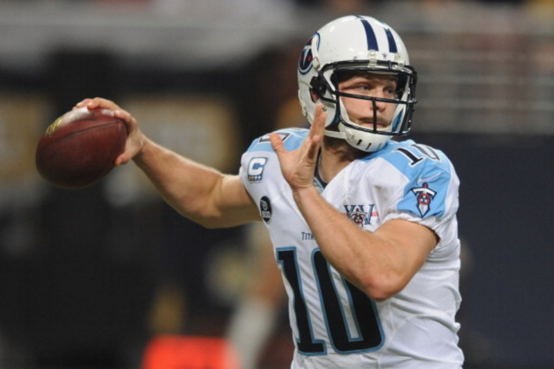 Tennessee Titans quarterback Jake Locker (10) scrambles against