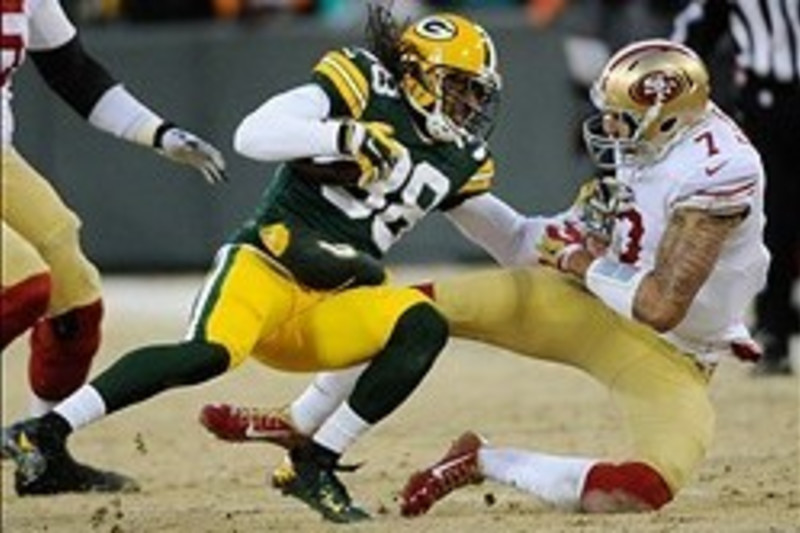 San Francisco 49ers quarterback Colin Kaepernick throws a pass during the  fourth quarter of the NFC Wildcard Playoff against the Green Bay Packers at  Lambeau Field in Green Bay, Wisconsin on January