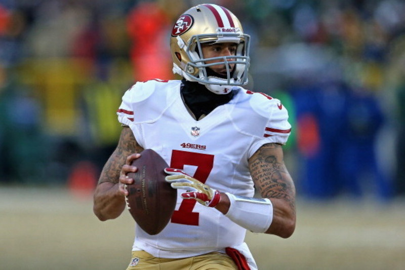 San Francisco 49ers quarterback Colin Kaepernick (7) walks off the field  after the second half of a divisional playoff NFL football game against the  Carolina Panthers, Sunday, Jan. 12, 2014, in Charlotte