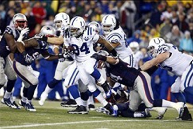 Brady Outplays Luck, Patriots Rout Colts 59-24