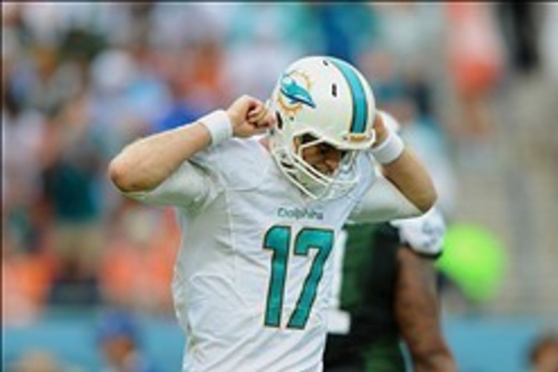 Miami Dolphins quarterback Ryan Tannehill (17) stands on a stage