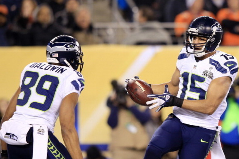 Denver Broncos tight end Julius Thomas (80) watches as the pass intended  for him is about to be intercepted by Seattle Seahawks strong safety Kam  Chancellor (31) at the Super Bowl XLVIII