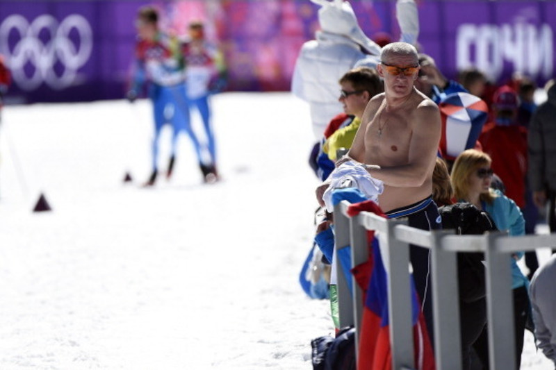 Sochi, Russia. 12th February 2014. A Spectator wears a drinking