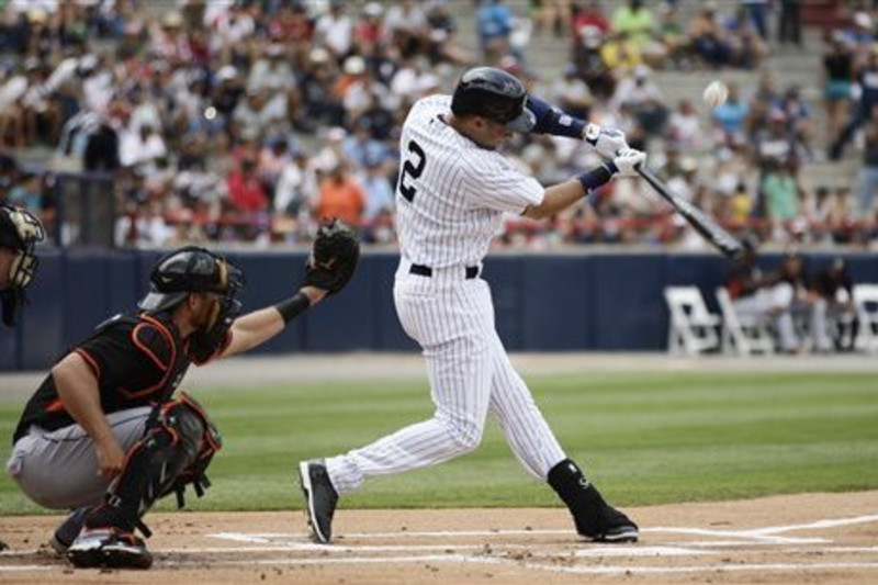 The Boston Red Sox's Jacoby Ellsbury hits a three-run home run in the 14th  inning against the New York Yankees. The Red Sox defeated the Yankees, 7-4,  in the second game of