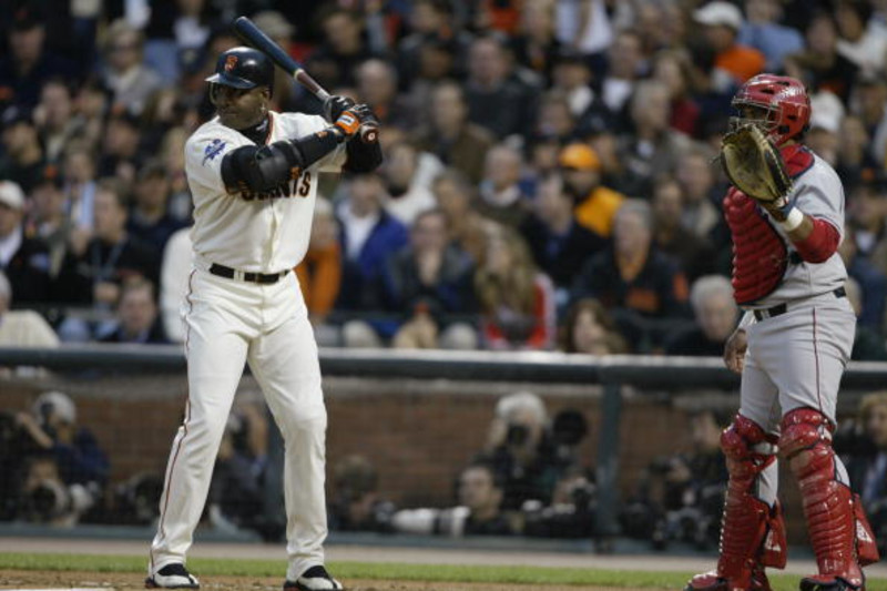 San Francisco Giants' Barry Bonds stretches in the outfield in the