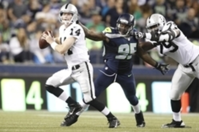 Seattle Seahawks defensive end Benson Mayowa (10) lines up against