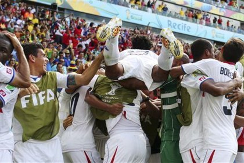 Costa Rica, Italy pull off upset wins