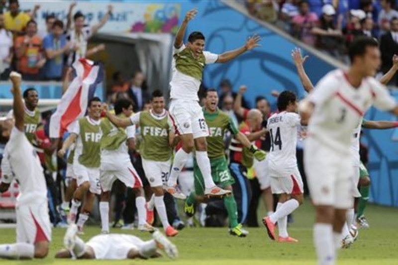 Costa Rica, Italy pull off upset wins