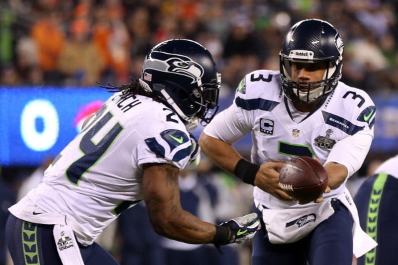 Seattle Seahawks running back Marshawn Lynch (24) beat a drum as