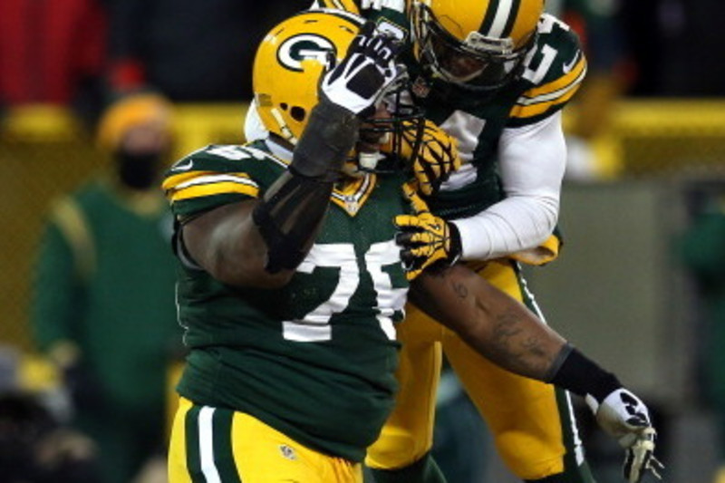 Green Bay Packers cornerback Jarrett Bush (24) holds the ball