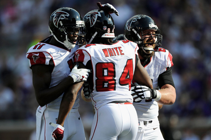 Atlanta Falcons wide receiver Julio Jones (11) celebrates his touchdown  with teammate Peter Konz in the second half of their NFL football game  against the New York Giants at the Georgia Dome