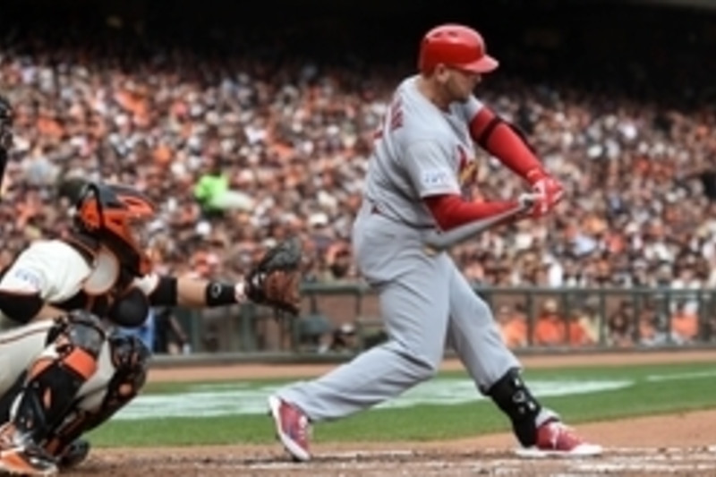 St. Louis Cardinals left fielder Matt Holliday (7) reacts after he hits a  three run home run in the seventh inning against the Los Angeles Dodgers in  game one of the 2014