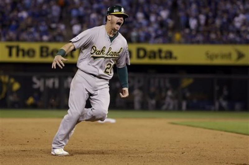 Josh Donaldson #20 of the Toronto Blue Jays reacts as he is stranded at the  end…