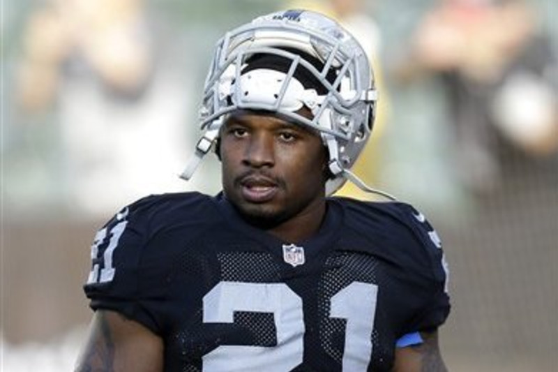 Oakland Raiders running back Darren McFadden (20) makes a catch as he warms  up before an NFL game against the New England Patriots at Gillette Stadium  in Foxborough, Mass. on Sunday, Sept.