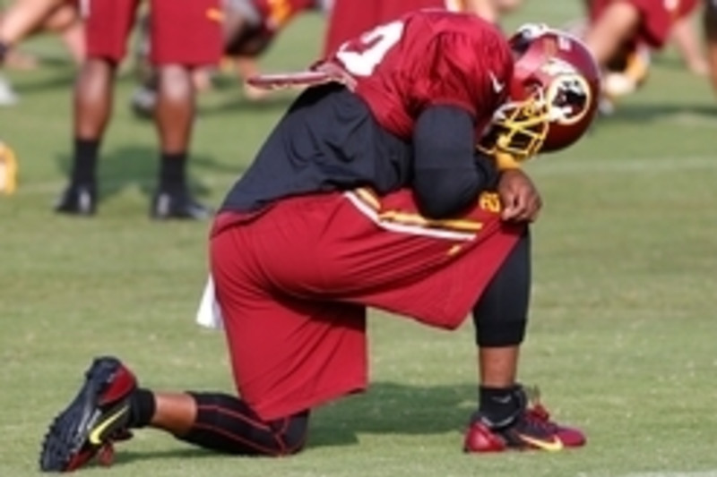 Washington Redskins Stephen Bowen celebrates with Barry Cofield