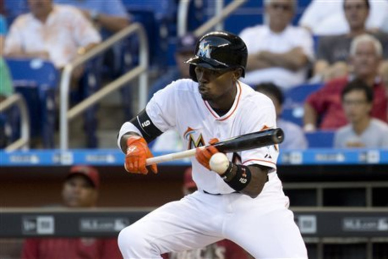 Miami Marlins second baseman Dee Gordon and shortstop Adeiny Hechavarria  congratulate each other after the Marlins defeated the Los Angeles Dodgers  5-3 in a baseball game, Thursday, April 28, 2016, in Los