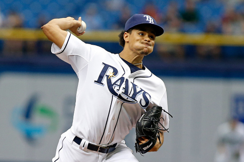 An American professional baseball player, Chris Archer holds a net