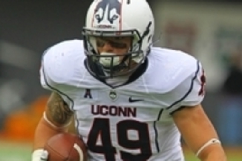 Running back Tony Hollings of the Houston Texans carries the ball