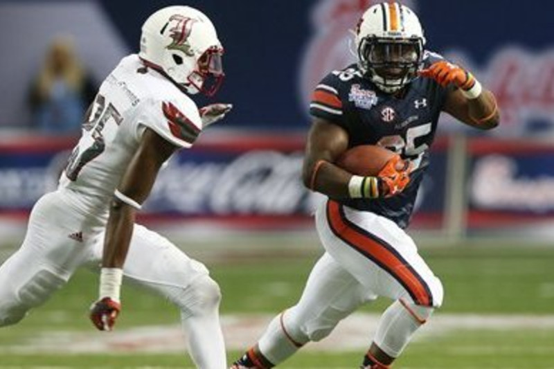 Las Vegas Raiders running back Peyton Barber does a headstand flip