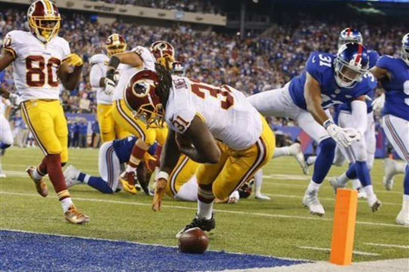 DeMARCO MURRAY hurdles over BRANDON CARR