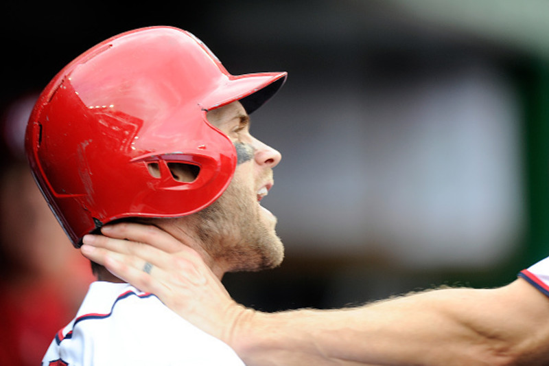 Philadelphia Phillies' Bryce Harper (3) wears a belt with (34) on it, his  old number, in the dugout during the fifth inning of a baseball game  against the Washington Nationals at Nationals