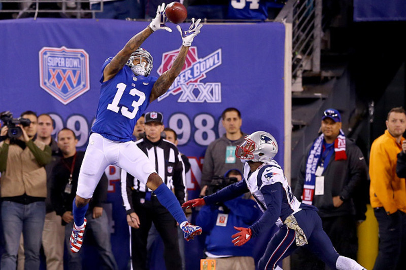 New York Giants Odell Beckham Jr. celebrates in the end zone after catching  a 87 yard touchdown pass in the first quarter against the New England  Patriots at MetLife Stadium in East