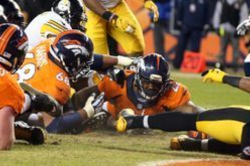 Running back C.J. Anderson (22) carries the ball during the NFL Super Bowl  50 – Denver Broncos History