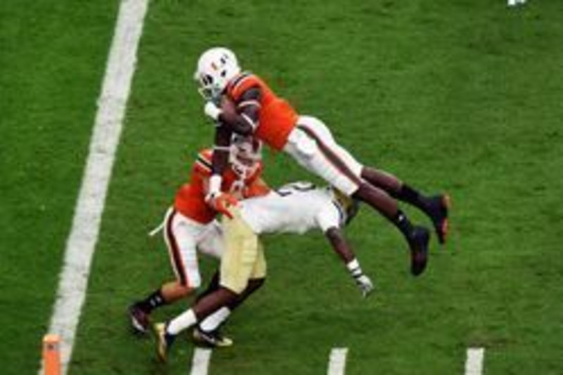 Miami receiver Evidence Njoku (83) poses with his brother, Cleveland Browns  tight end David Njoku, after the Miami NCAA college football Spring Game  Saturday, April 20, 2019, in Orlando, Fla. (Phelan M.