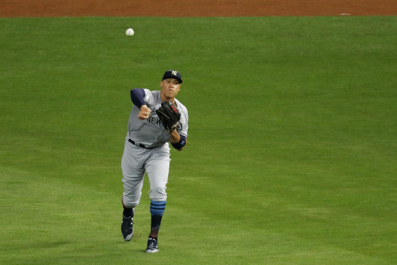 New York Yankees right fielder Aaron Judge (99) throws a ball to