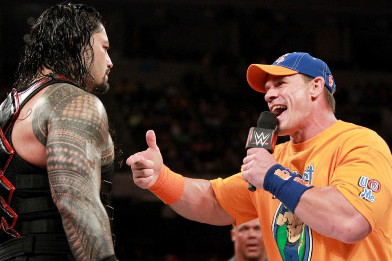 John Cena talks trash to Roman Reigns.