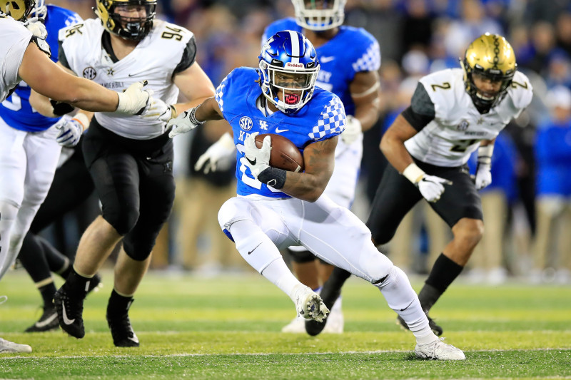 Kentucky running back Benjamin Snell Jr. runs the ball past New Mexico  State defensive back Jaden Wright in the first half of an NCAA college  football game against New Mexico State Saturday