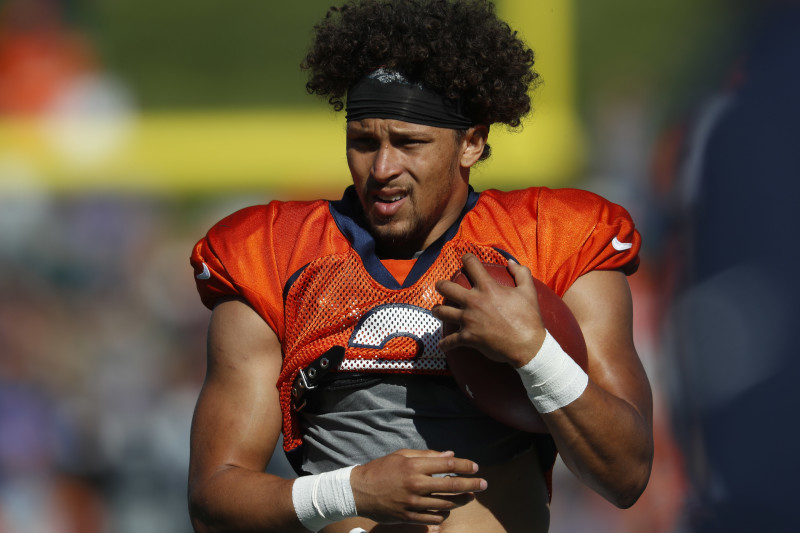 Denver Broncos running back Phillip Lindsay (30) shares a laugh with Las  Vegas Raiders running …