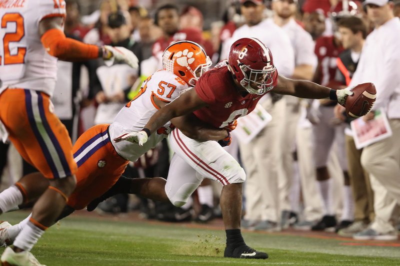 Josh Jacobs Alabama Crimson Tide Unsigned White Jersey Running Photograph