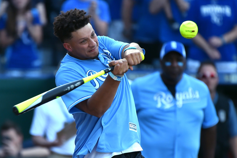 KANSAS CITY, MISSOURI - JUNE 07: Quarterback Patrick Mahomes (back) of the Kansas City Chiefs hits a ball during the Big Slick celebrity softball game prior to a game between the Chicago White Sox and Kansas City Royals  at Kauffman Stadium on June 07, 20