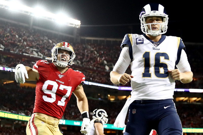 Santa Clara, California, USA. 21st Dec, 2019. Los Angeles Rams quarterback  Jared Goff (16) passes under pressure from San Francisco 49ers defensive  end Nick Bosa (97) during the NFL game between the