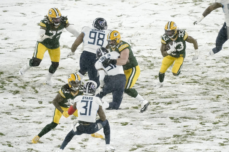 Aaron Rodgers throws 4 TD passes in the snow as the Green Bay Packers rout  the Tennessee Titans: Recap, score, stats and more 