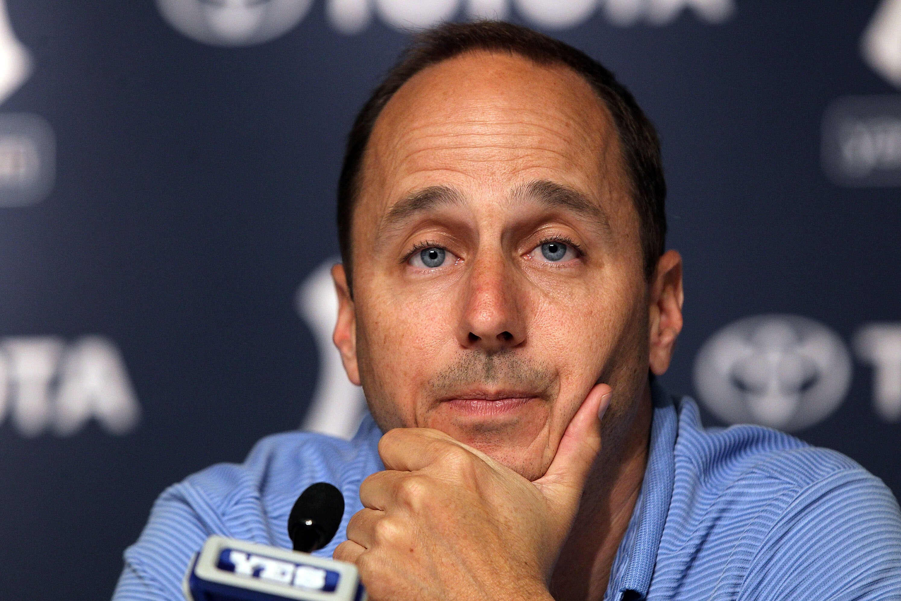 NEW YORK, NY - JULY 08:  General manager Brian Cashman of the New York Yankees speaks to the media after the game against the Tampa Bay Rays was postponed due to rain on July 8, 2011 at Yankee Stadium in the Bronx borough of New York City.  (Photo by Jim McIsaac/Getty Images)