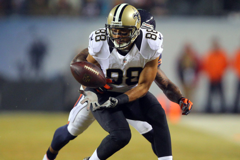 Dec 15, 2014; Chicago, IL, USA; New Orleans Saints wide receiver Nick Toon (88) catches a pass in front of Chicago Bears cornerback Tim Jennings (26) during the second quarter at Soldier Field. Mandatory Credit: Dennis Wierzbicki-USA TODAY Sports