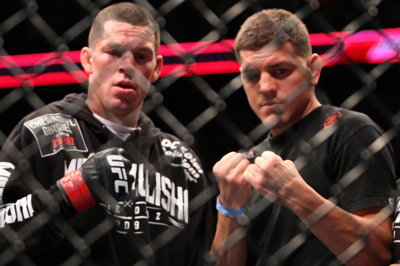 Nate Diaz, left, poses with his brother Nick Diaz, center and a cornerman after defeating Jim Miller in their lightweight bout at UFC on Fox at the Izod Center in E. Rutherford, NJ on Saturday, May 5, 2012. Diaz won via tapout due to a choke in round 2. (AP Photo/Gregory Payan)
