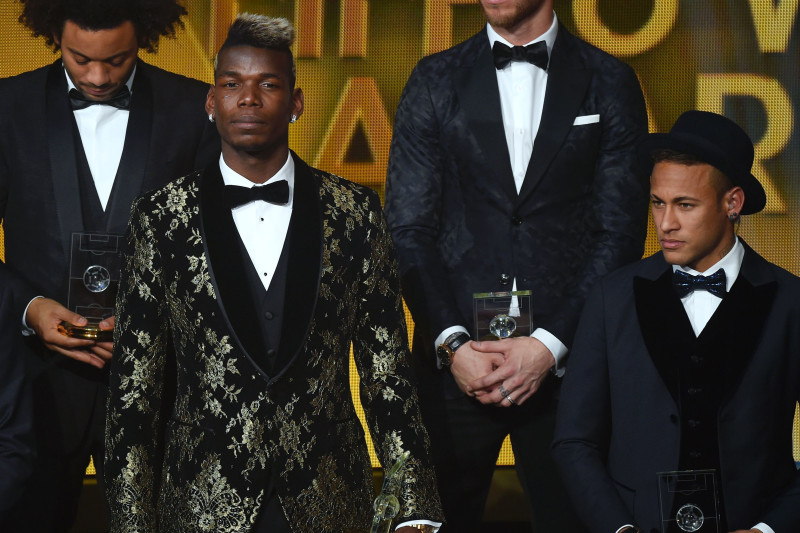 (From L) Brazil and Paris Saint-Germain defender Thiago Silva, Croatia and Real Madrid midfielder Luka Modric, Brazil and Real Madrid defender Marcelo, France and Juventus midfielder Paul Pogba, Spain and Real Madrid defender Sergio Ramos and Brazil and FC Barcelona forward Neymar pose on stage  after being selected in the 2015 FIFA FIFPro World XI during the 2015 FIFA Ballon d'Or award ceremony at the Kongresshaus in Zurich on January 11, 2016. AFP PHOTO / OLIVIER MORIN / AFP / OLIVIER MORIN        (Photo credit should read OLIVIER MORIN/AFP/Getty Images)