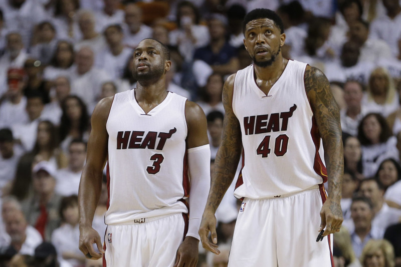 Miami Heat forward Udonis Haslem (40) and guard Dwyane Wade (3) look up during the second half of Game 3 of an NBA second-round playoff basketball series against the Toronto Raptors, Saturday, May 7, 2016, in Miami. (AP Photo/Alan Diaz)