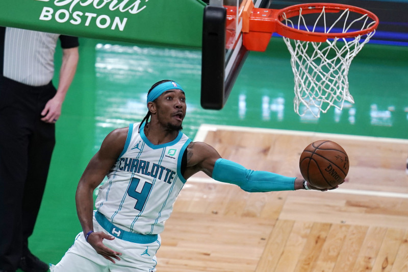 Charlotte Hornets guard Devonte' Graham (4) drives to the basket against the Boston Celtics during the second half of an NBA basketball game, Wednesday, April 28, 2021, in Boston. (AP Photo/Charles Krupa)